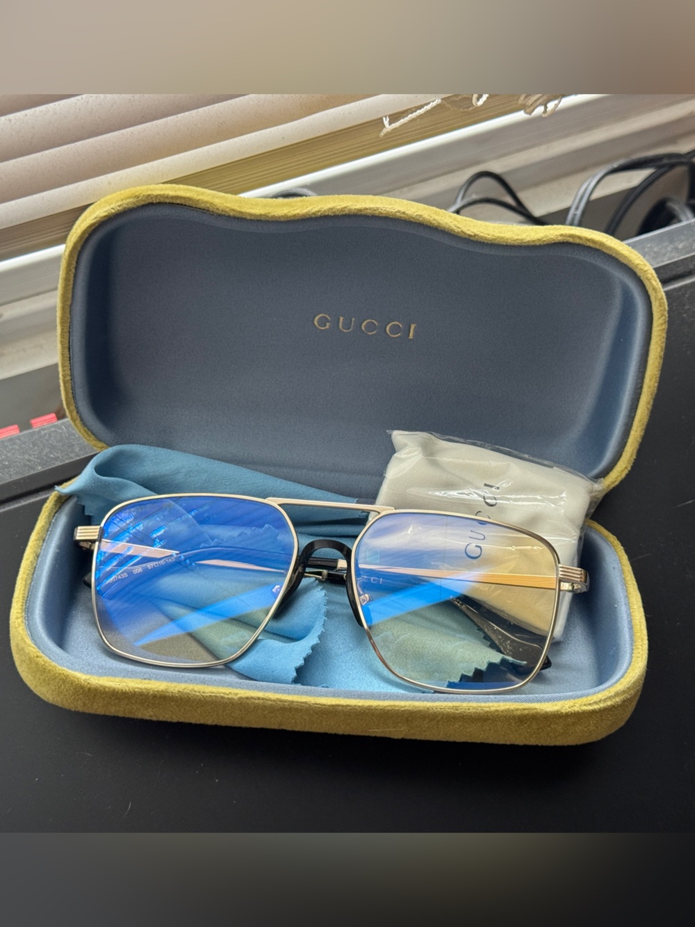Gucci Women’s Gold Frame Sunglasses with Champagne Polarized Lenses